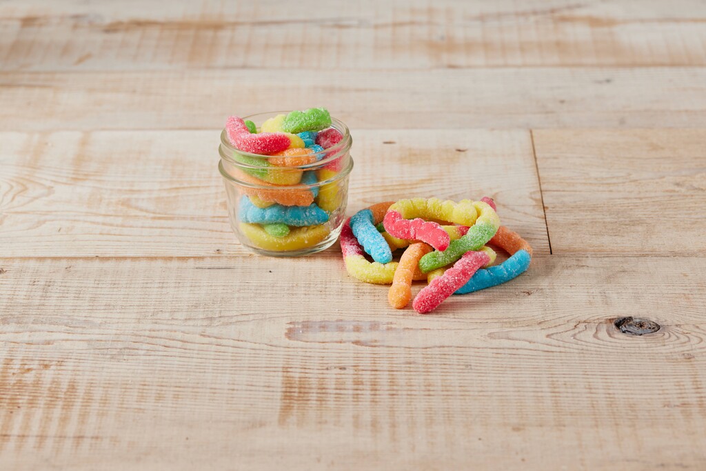 A photo of a cup of Sour Gummy Worms