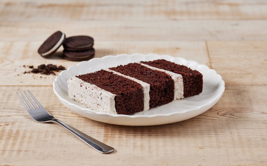 A photo of a slice of Cookies & Cream Cake