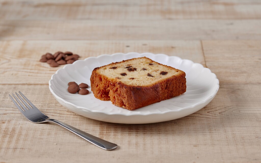 A photo of a slice of Chocolate Chip Loaf Cake