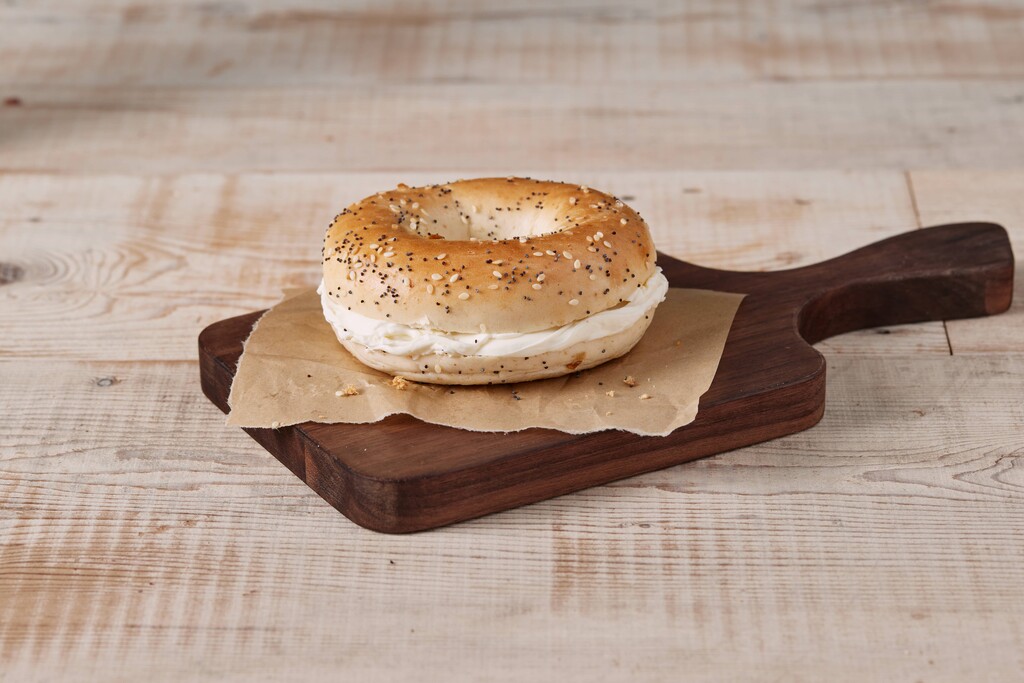 A photo of a bagel and cream cheese